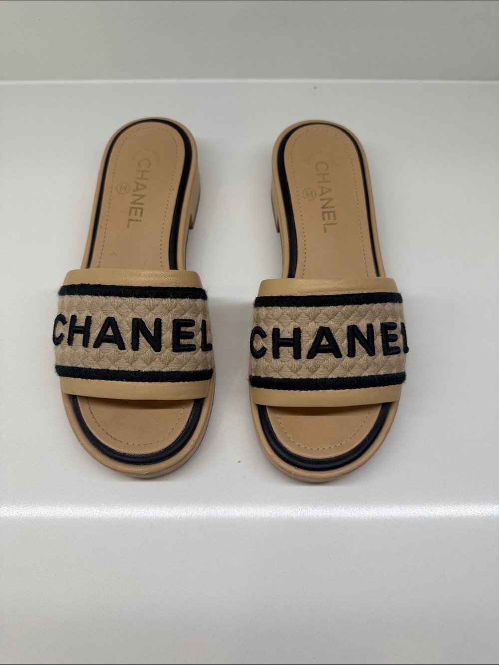 CHANEL Tan and Black Quilted Logo Slide Mules